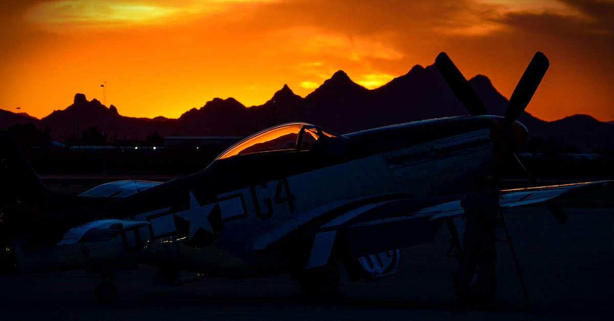 P-51-A P-51 Mustang sits on the flightline during a sunset after the first day of the 2016 Heritage Flight Training