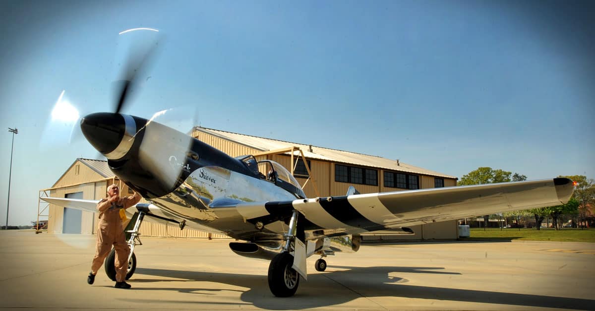 P-51-Mr. Bill Yoak, P-51 Mustang owner and crew chief, performs preflight checks prior to takeoff