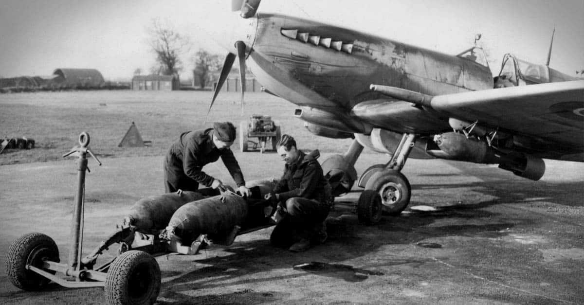 Supermarine Spitfire- Armourers loading bombs onto a Spitfire Mk XVI